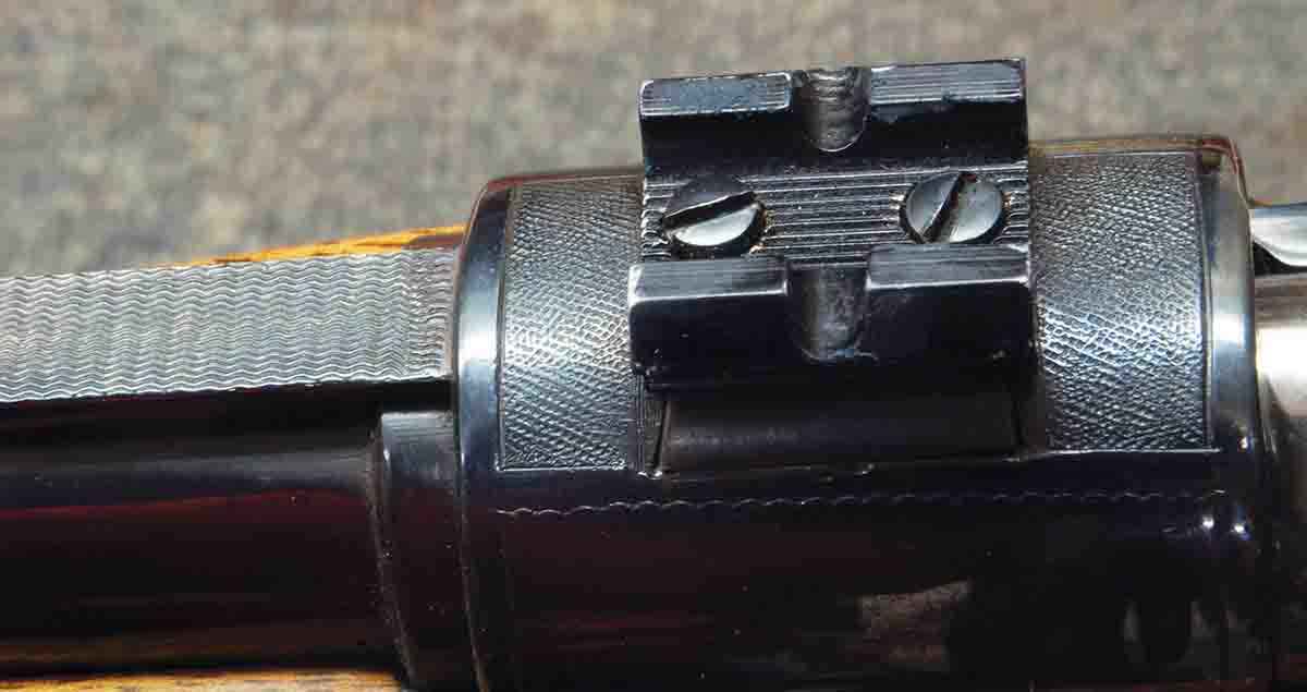 The hole spacing is incorrect on this import base. The front screw head is higher than the rear and angled toward the camera. The base looks like a Weaver, but has no part number and is painted.